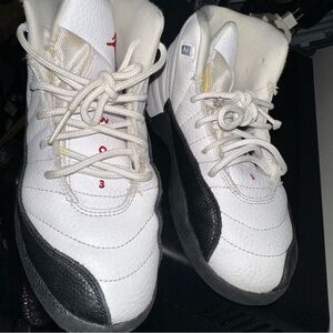 Jordan White and Black Sneakers with Red Accents Jordan Retro Taxi Flip 12”